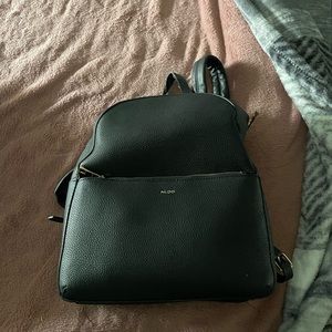 Also leather bookbag